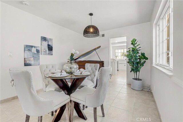 9921 Oceancrest Dr, Huntington Beach, CA 92646 - dining room with light tile patterned floors and baseboards