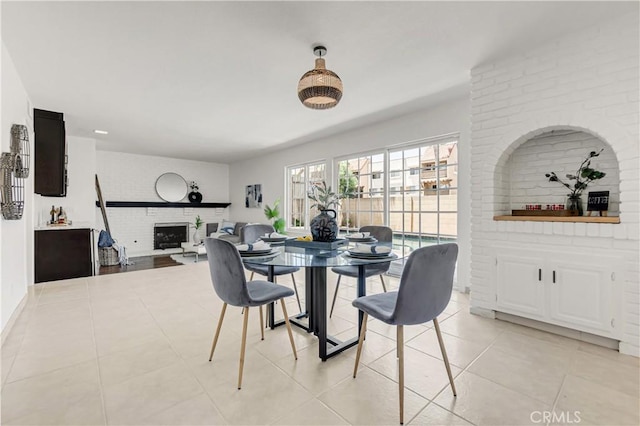 9921 Oceancrest Dr, Huntington Beach, CA 92646 - dining room with a fireplace and light tile patterned flooring