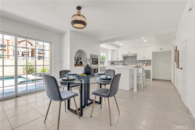 9921 Oceancrest Dr, Huntington Beach, CA 92646 - dining area featuring light tile patterned floors and recessed lighting