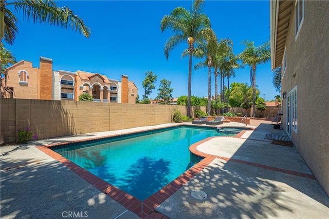 9921 Oceancrest Dr, Huntington Beach, CA 92646 - view of swimming pool featuring a fenced backyard, a patio area, and a hot tub