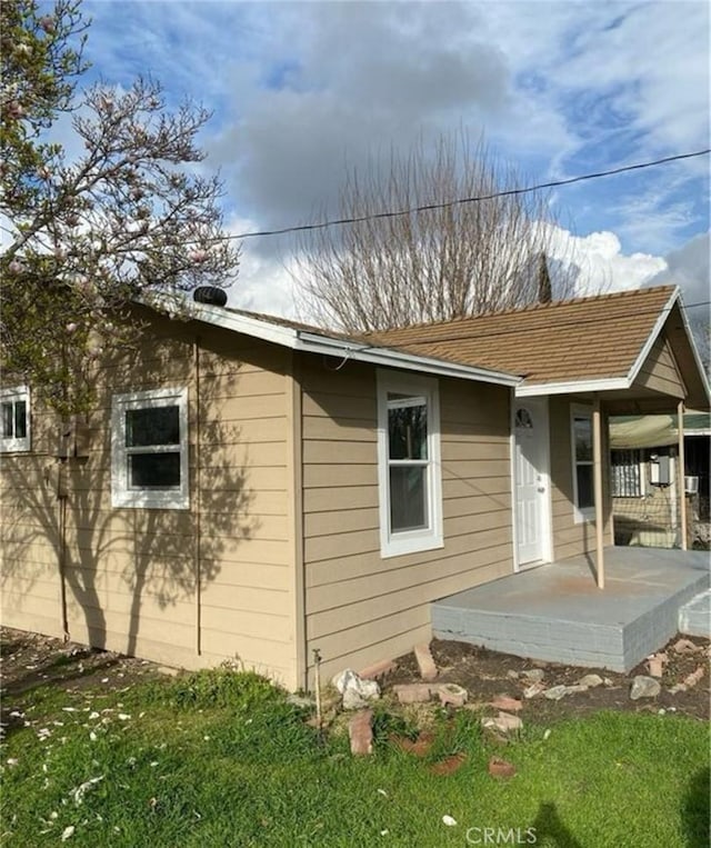 1220 W 7th St, San Bernardino, CA 92411 - back of property with a porch and a lawn
