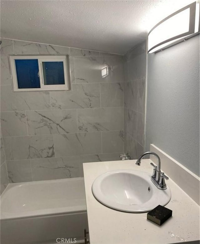 1220 W 7th St, San Bernardino, CA 92411 - bathroom with a textured ceiling, vanity, and shower / bath combination