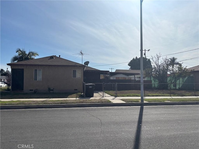 4203 Deland Ave, Pico Rivera, CA 90660 - view of front of property featuring stucco siding and a gate