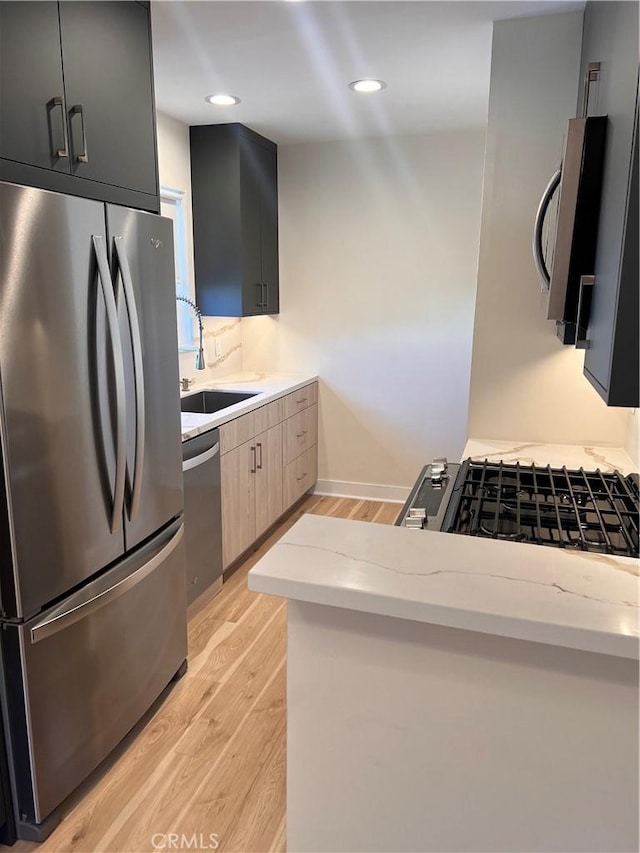 5126 Colfax Ave, Valley Village, CA 91601 - kitchen with stainless steel appliances, light wood-style floors, light stone countertops, and recessed lighting