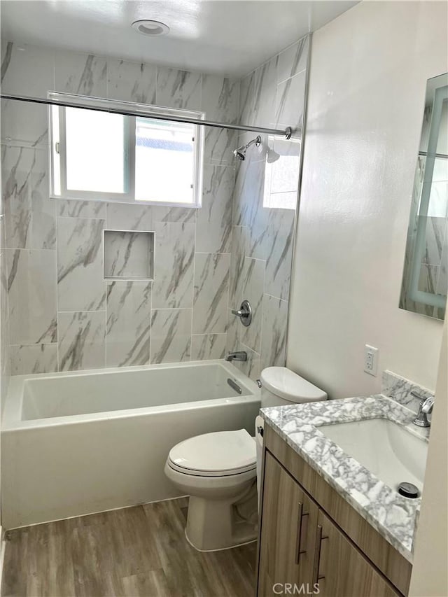 5126 Colfax Ave, Valley Village, CA 91601 - bathroom with vanity, washtub / shower combination, and wood finished floors