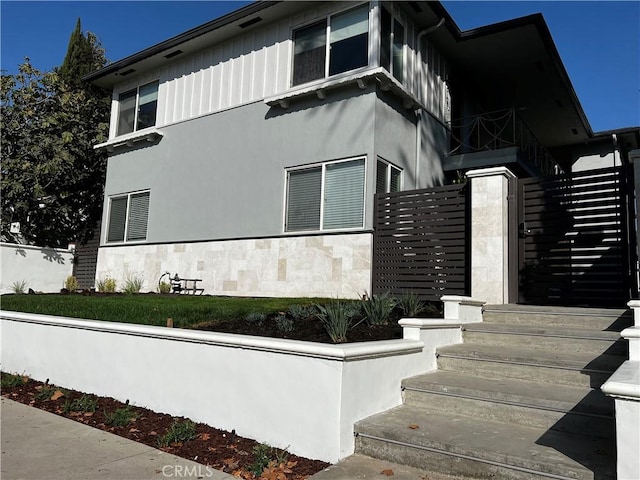 5126 Colfax Ave, Valley Village, CA 91601 - view of home's exterior featuring stairway and stucco siding