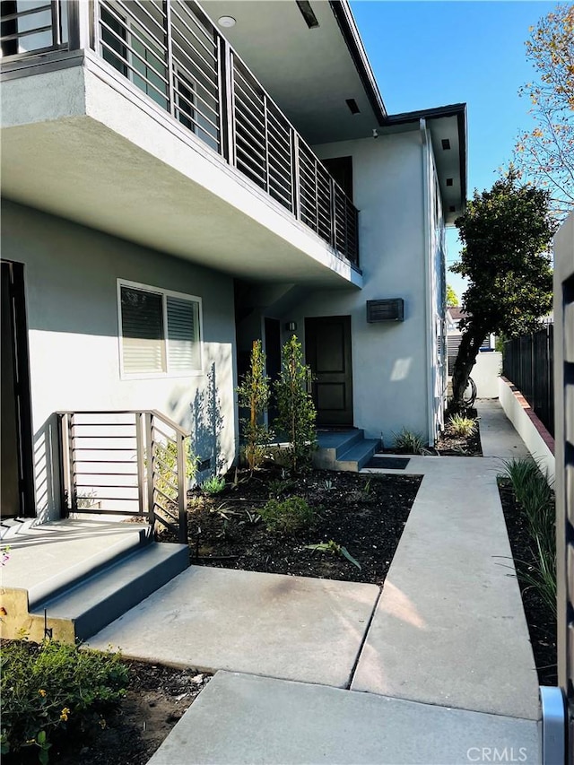 5126 Colfax Ave, Valley Village, CA 91601 - property entrance featuring stucco siding and a balcony
