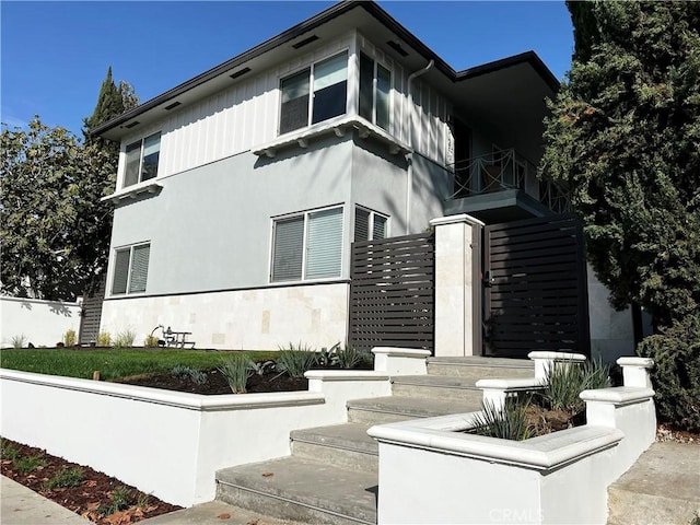 5126 Colfax Ave, Valley Village, CA 91601 - view of home's exterior featuring stairway and stucco siding
