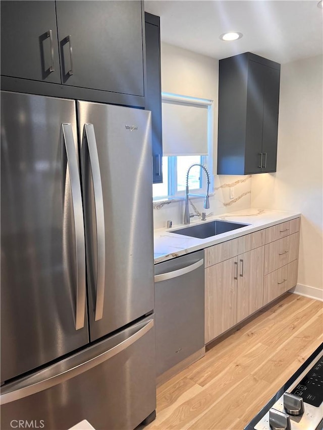 5126 Colfax Ave, Valley Village, CA 91601 - kitchen with appliances with stainless steel finishes, light wood-style flooring, light brown cabinetry, and light countertops