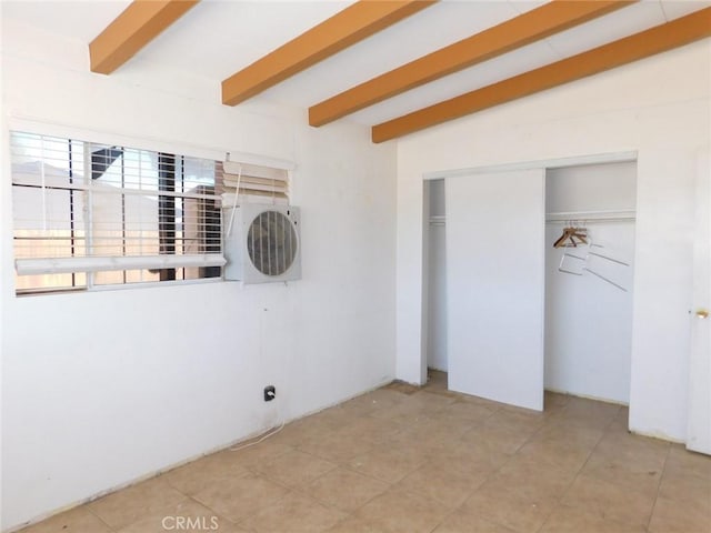 14200 Pawnee Rd, Apple Valley, CA 92307 - unfurnished bedroom with beam ceiling, a closet, and light tile patterned floors