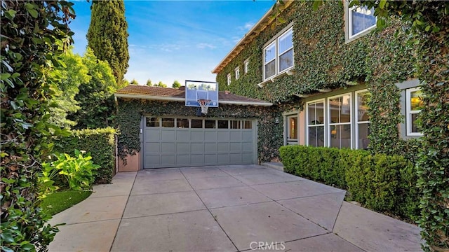 16 Bayleaf Ln, Irvine, CA 92620 - view of property exterior featuring a garage