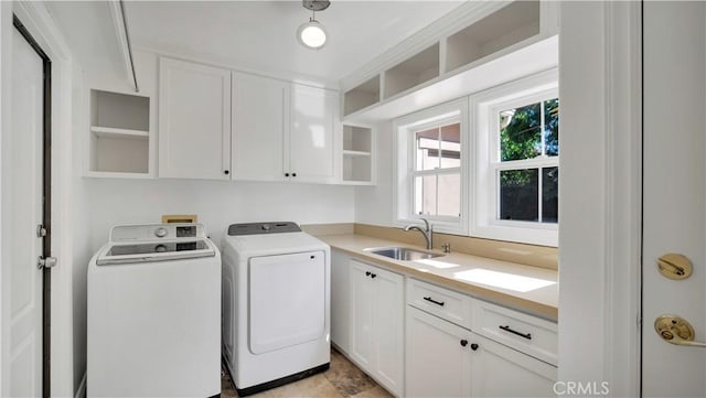 16 Bayleaf Ln, Irvine, CA 92620 - washroom featuring cabinet space and washer and dryer