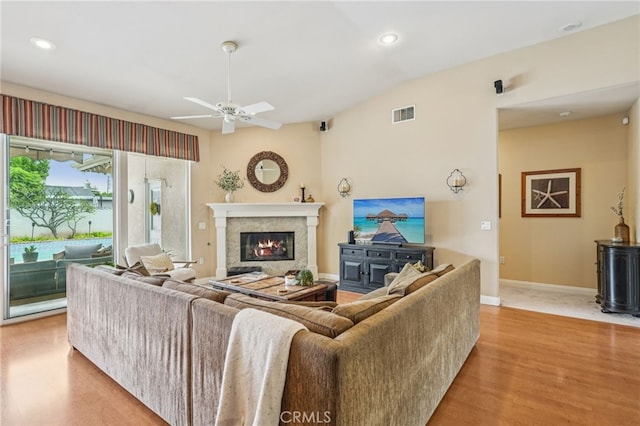 11272 Weatherby Rd, Los Alamitos, CA 90720 - living area featuring a ceiling fan, wood finished floors, a glass covered fireplace, and recessed lighting