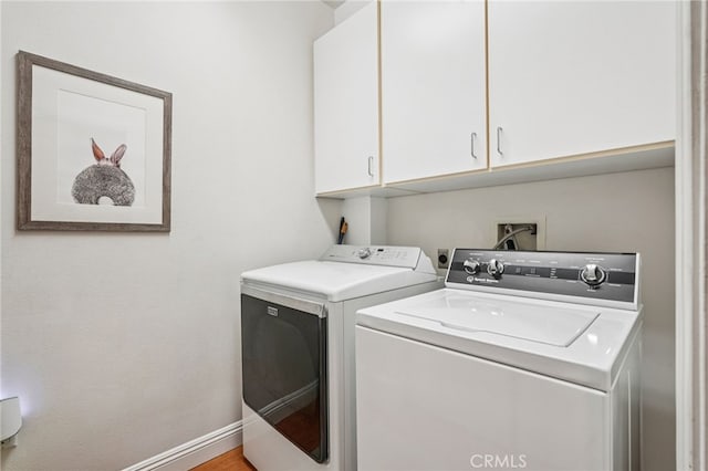 11272 Weatherby Rd, Los Alamitos, CA 90720 - laundry room featuring cabinet space and washing machine and clothes dryer