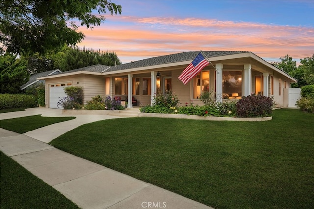 11272 Weatherby Rd, Los Alamitos, CA 90720 - ranch-style home featuring a porch, a yard, an attached garage, and concrete driveway