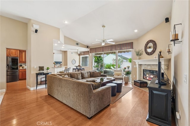 11272 Weatherby Rd, Los Alamitos, CA 90720 - living room with ceiling fan, light wood-style floors, a premium fireplace, recessed lighting, and high vaulted ceiling