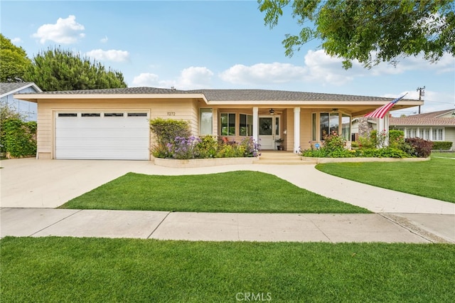 11272 Weatherby Rd, Los Alamitos, CA 90720 - single story home featuring ceiling fan, a front lawn, an attached garage, concrete driveway, and a porch
