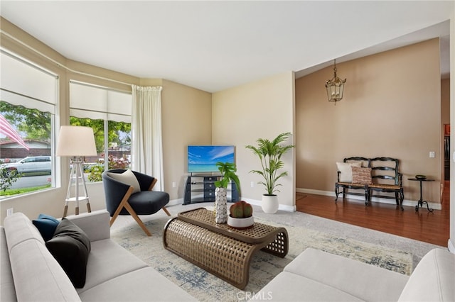 11272 Weatherby Rd, Los Alamitos, CA 90720 - living room with baseboards and wood finished floors