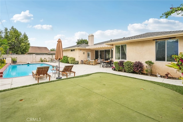 11272 Weatherby Rd, Los Alamitos, CA 90720 - view of swimming pool featuring an area to practice putting and a patio area