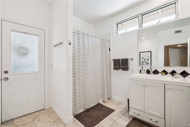 11272 Weatherby Rd, Los Alamitos, CA 90720 - bathroom with vanity, a shower with shower curtain, and backsplash