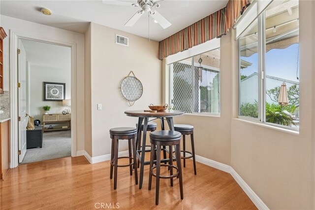 11272 Weatherby Rd, Los Alamitos, CA 90720 - dining area with plenty of natural light, wood finished floors, and ceiling fan
