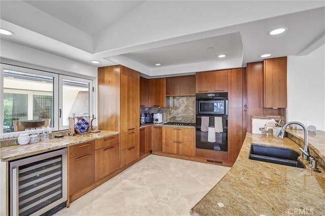 34586 Camino Capistrano Unit A, Dana Point, CA 92624 - kitchen with wine cooler, brown cabinetry, light stone countertops, backsplash, and stainless steel gas cooktop