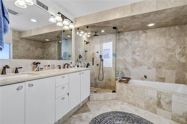 34586 Camino Capistrano Unit A, Dana Point, CA 92624 - bathroom with tiled shower, double vanity, a bath, and tile walls