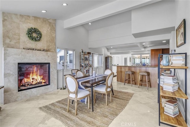 34586 Camino Capistrano Unit A, Dana Point, CA 92624 - dining room featuring recessed lighting, a tile fireplace, and beam ceiling