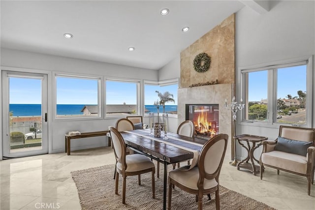 34586 Camino Capistrano Unit A, Dana Point, CA 92624 - dining space with recessed lighting, a water view, high vaulted ceiling, a fireplace, and light tile patterned floors
