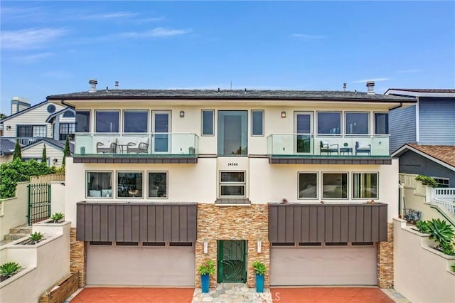 34586 Camino Capistrano Unit A, Dana Point, CA 92624 - townhome / multi-family property featuring a garage, driveway, and stucco siding