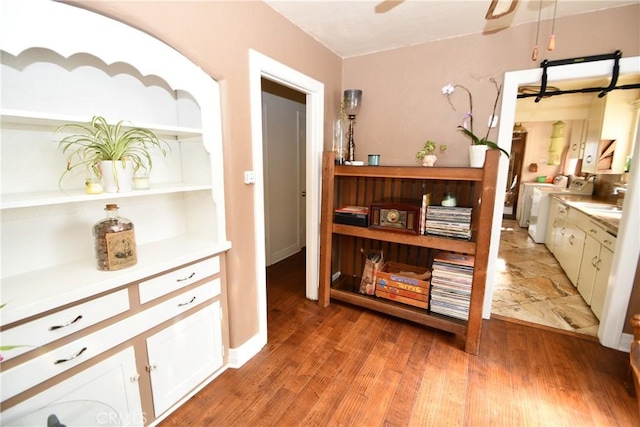 1862 261st St, Lomita, CA 90717 - corridor featuring washer and clothes dryer and light wood-style flooring