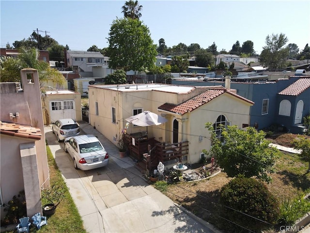 1862 261st St, Lomita, CA 90717 - view of front of property with concrete driveway, stucco siding, a tiled roof, and a residential view