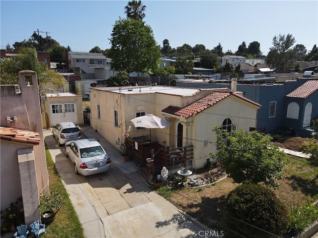 1862 261st St, Lomita, CA 90717 - view of front of property featuring a tile roof, driveway, stucco siding, and a residential view