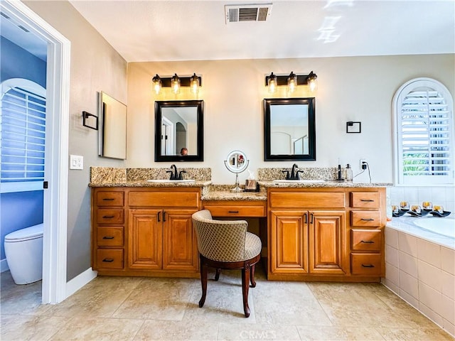 14207 Ashton Ln, Riverside, CA 92508 - bathroom with double vanity and a garden tub
