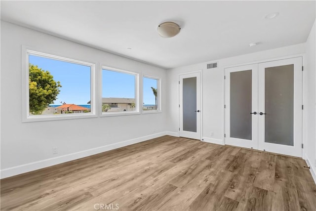 34586 Camino Capistrano Unit B, Dana Point, CA 92624 - unfurnished bedroom featuring french doors and wood finished floors
