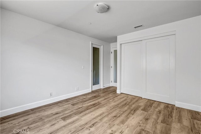 34586 Camino Capistrano Unit B, Dana Point, CA 92624 - unfurnished bedroom featuring wood finished floors and a closet