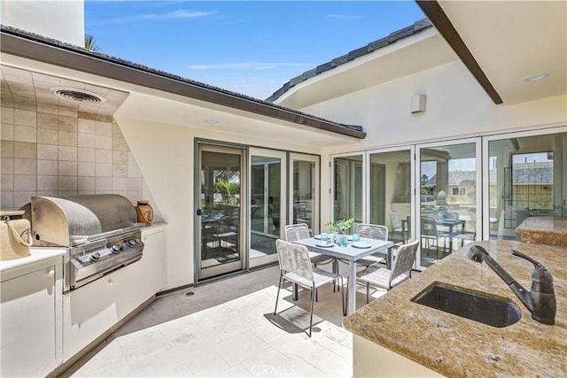 34586 Camino Capistrano Unit B, Dana Point, CA 92624 - view of patio featuring an outdoor kitchen and outdoor dining space