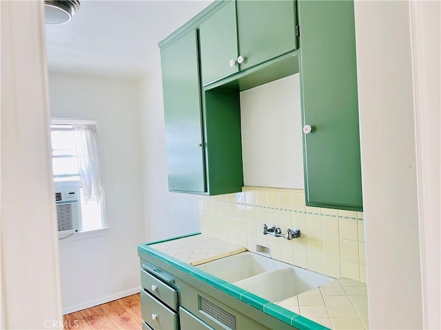 122 Elm Ave Unit 10, Long Beach, CA 90802 - bathroom featuring tasteful backsplash, wood finished floors, and vanity