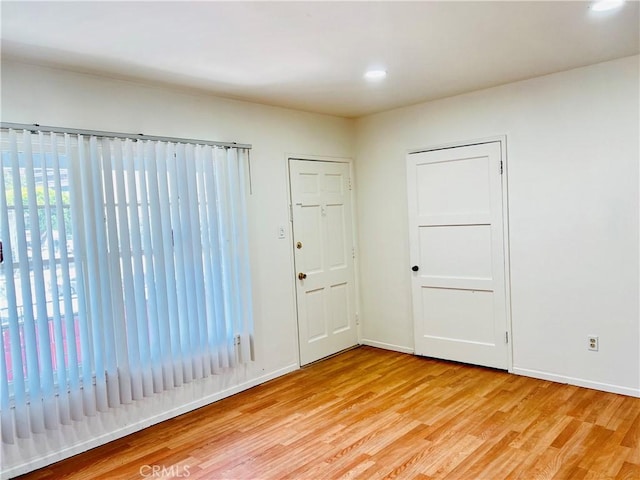 122 Elm Ave Unit 10, Long Beach, CA 90802 - empty room with light wood-style floors and recessed lighting