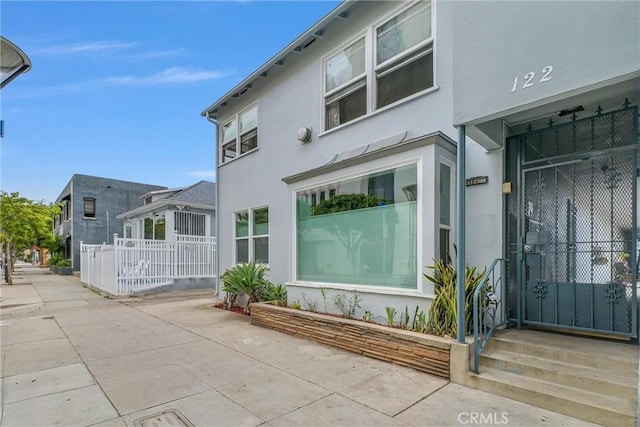 122 Elm Ave Unit 11, Long Beach, CA 90802 - view of side of home featuring stucco siding and a patio