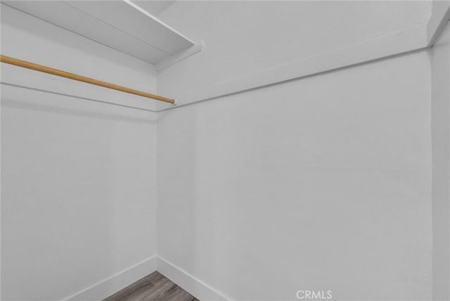 122 Elm Ave Unit 11, Long Beach, CA 90802 - walk in closet featuring wood finished floors