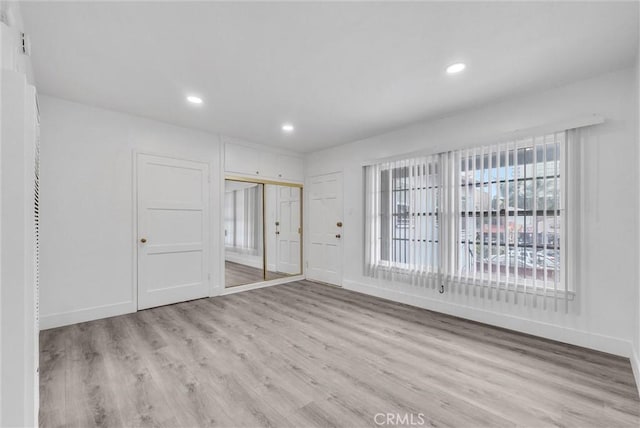 122 Elm Ave Unit 11, Long Beach, CA 90802 - spare room with light wood-style floors and recessed lighting