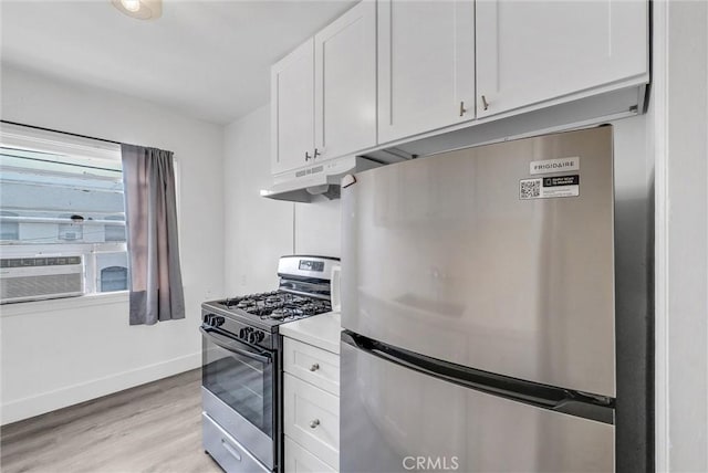 122 Elm Ave Unit 11, Long Beach, CA 90802 - kitchen with stainless steel appliances, white cabinets, light wood-type flooring, under cabinet range hood, and light countertops