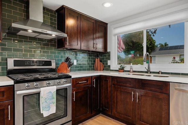 2203 Cameo Rd, Carlsbad, CA 92008 - kitchen featuring appliances with stainless steel finishes, wall chimney exhaust hood, light countertops, decorative backsplash, and recessed lighting