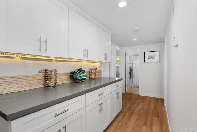 2203 Cameo Rd, Carlsbad, CA 92008 - kitchen with dark countertops, light wood-style flooring, recessed lighting, and white cabinetry