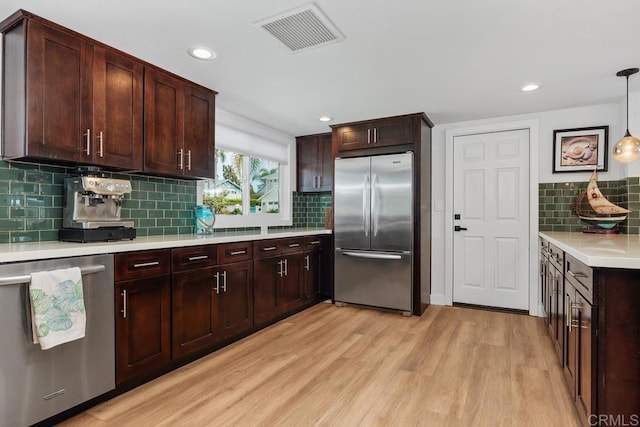 2203 Cameo Rd, Carlsbad, CA 92008 - kitchen featuring stainless steel appliances, light wood finished floors, light countertops, backsplash, and recessed lighting