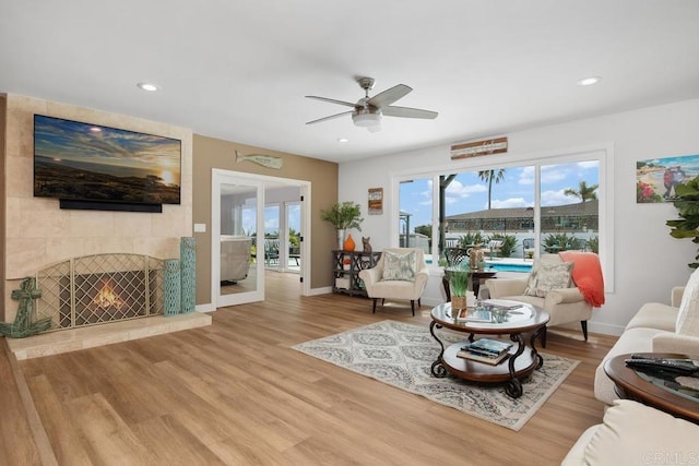 2203 Cameo Rd, Carlsbad, CA 92008 - living room featuring a ceiling fan, wood finished floors, recessed lighting, and a tile fireplace