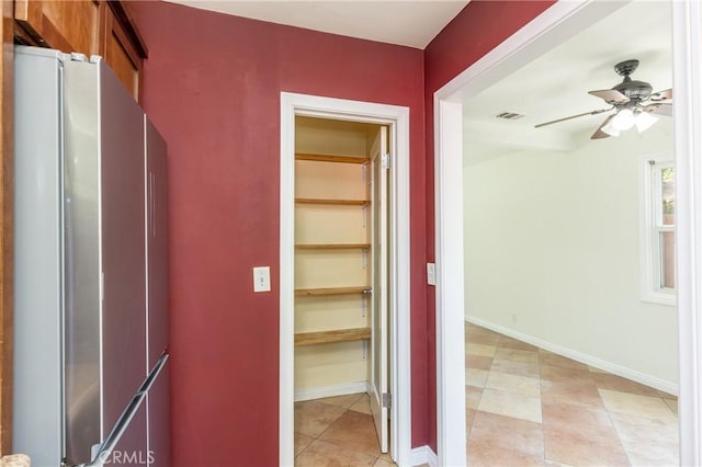 7441 Sylvia Ave, Reseda, CA 91335 - corridor featuring light tile patterned flooring and baseboards