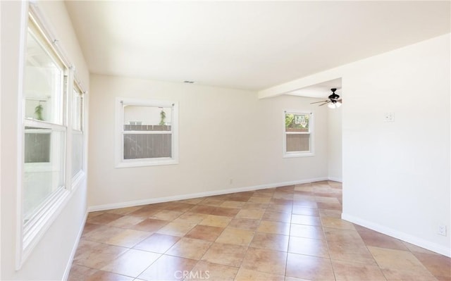 7441 Sylvia Ave, Reseda, CA 91335 - empty room with light tile patterned floors and ceiling fan