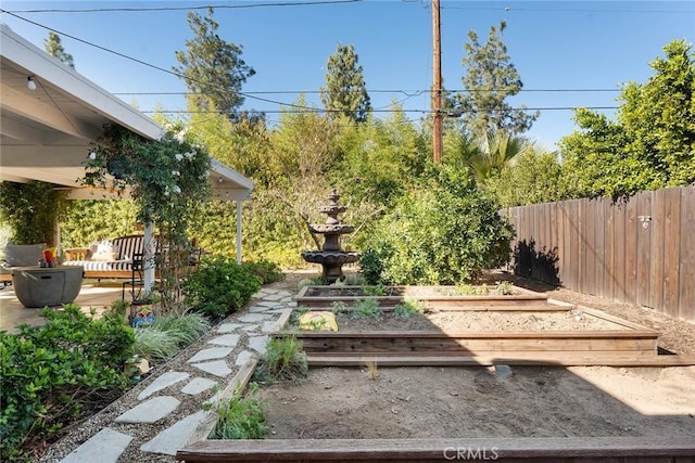 4835 Almidor Ave, Woodland Hills, CA 91364 - view of yard featuring a vegetable garden and a patio area